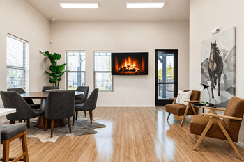Lounge with dining table and brown accent chairs